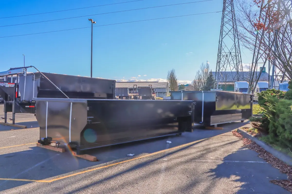 Roll-off dumpster ready for waste disposal at job site for Concrete Dumpster Rental in Daytona Beach